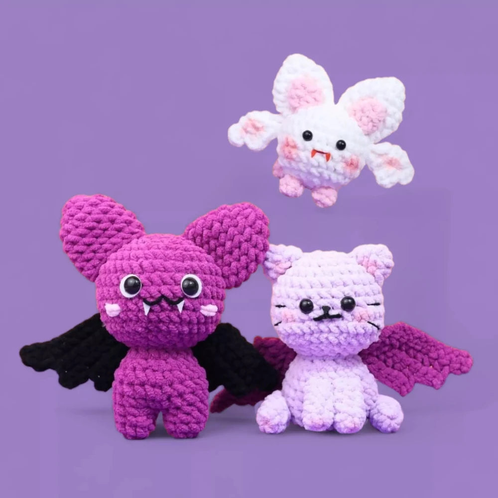 Halloween Crochet patterns for making a pink bat, a white rabbit bat, and a black cat bat crochet with a purple background.
