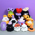 A collection of 35+ halloween crochet patterns Hooktasy including shapes like ghosts, cats, and pumpkins arranged against a purple background.