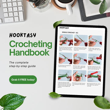 Hooktasy Crocheting Handbook E-books on a tablet with a keyboard and coffee cup in the background.