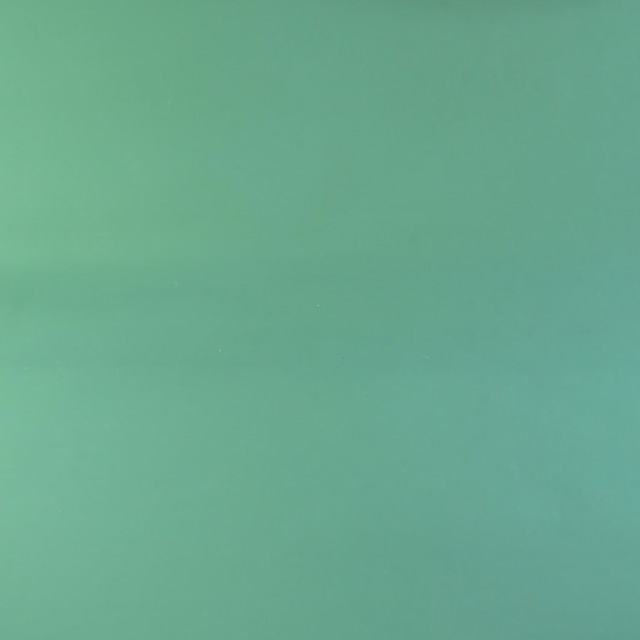 Video review Christmas candy cane sleepy dragon crocheted on a green background with snowflakes.